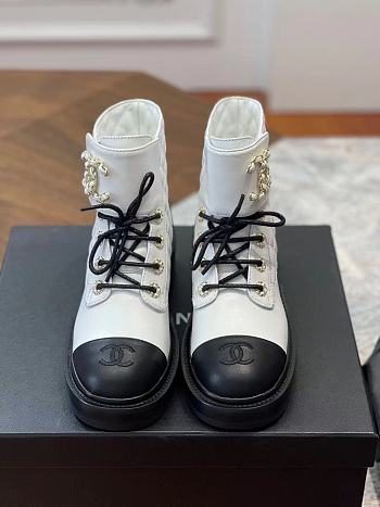 Chanel Lace-ups leather boots in white/black