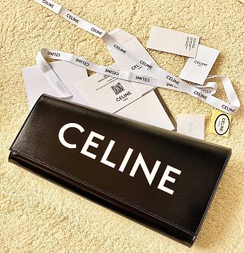 Celine asymetric clutch in shiny calfskin with celine print black Size 31.5x4x17 cm