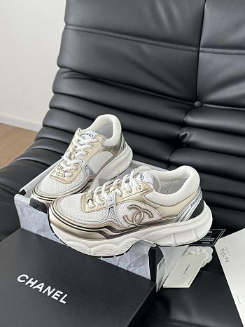 CHANEL MILTICOLOR LOGO SNEAKERS IN GOLD