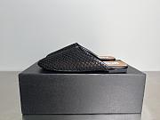Alaia Flat-soled half-slippers in black - 1