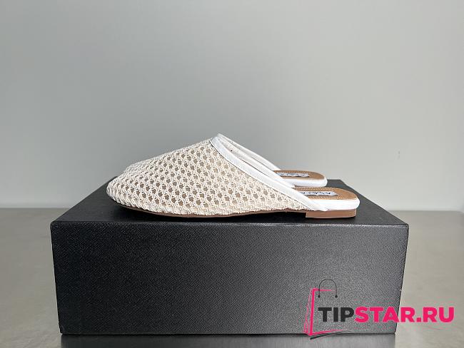 Alaia Flat-soled half-slippers in white - 1
