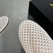Alaia Flat-soled half-slippers in white - 6