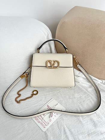Valentino Garavani Vsling Mini Handbag In Laminated Grainy White